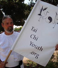 Paul Dunham with Tai Chi Youth flag 2007 Tujunga Parade